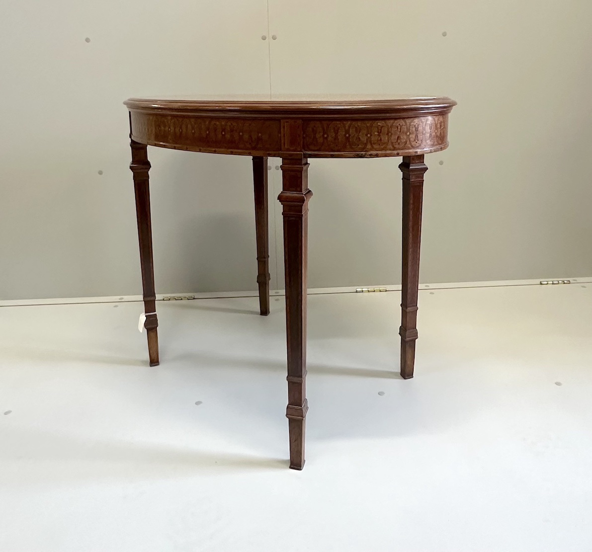 An Edwardian marquetry inlaid satinwood oval topped occasional table, width 89cm, depth 58cm, height 70cm